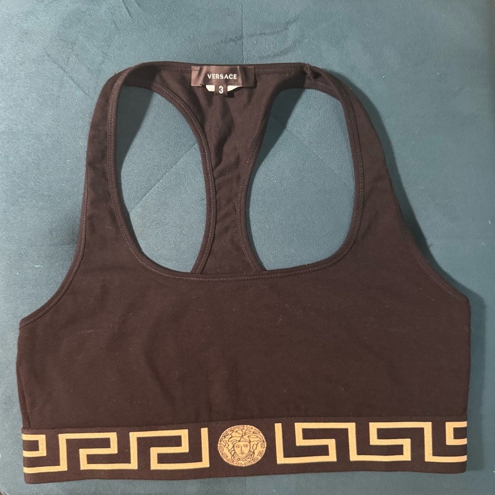Versace Greca Sports Bra. Never worn. Provides light support. Elastic logo band.